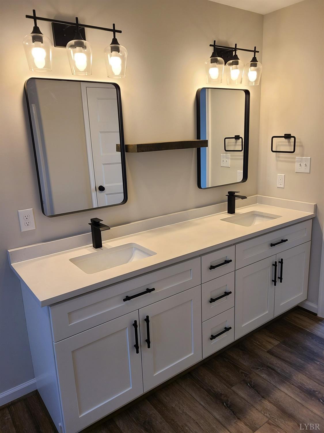 3353 Stonewall Road Concord, VA 24538 - Photo 17 of 21 a bathroom with a double vanity sink and mirror