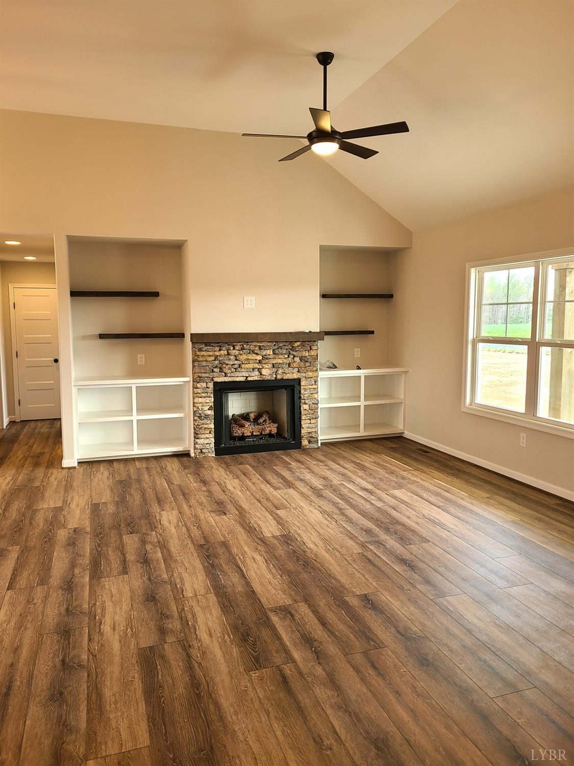 3353 Stonewall Road Concord, VA 24538 - Photo 3 of 21 an empty room with furniture and a fireplace
