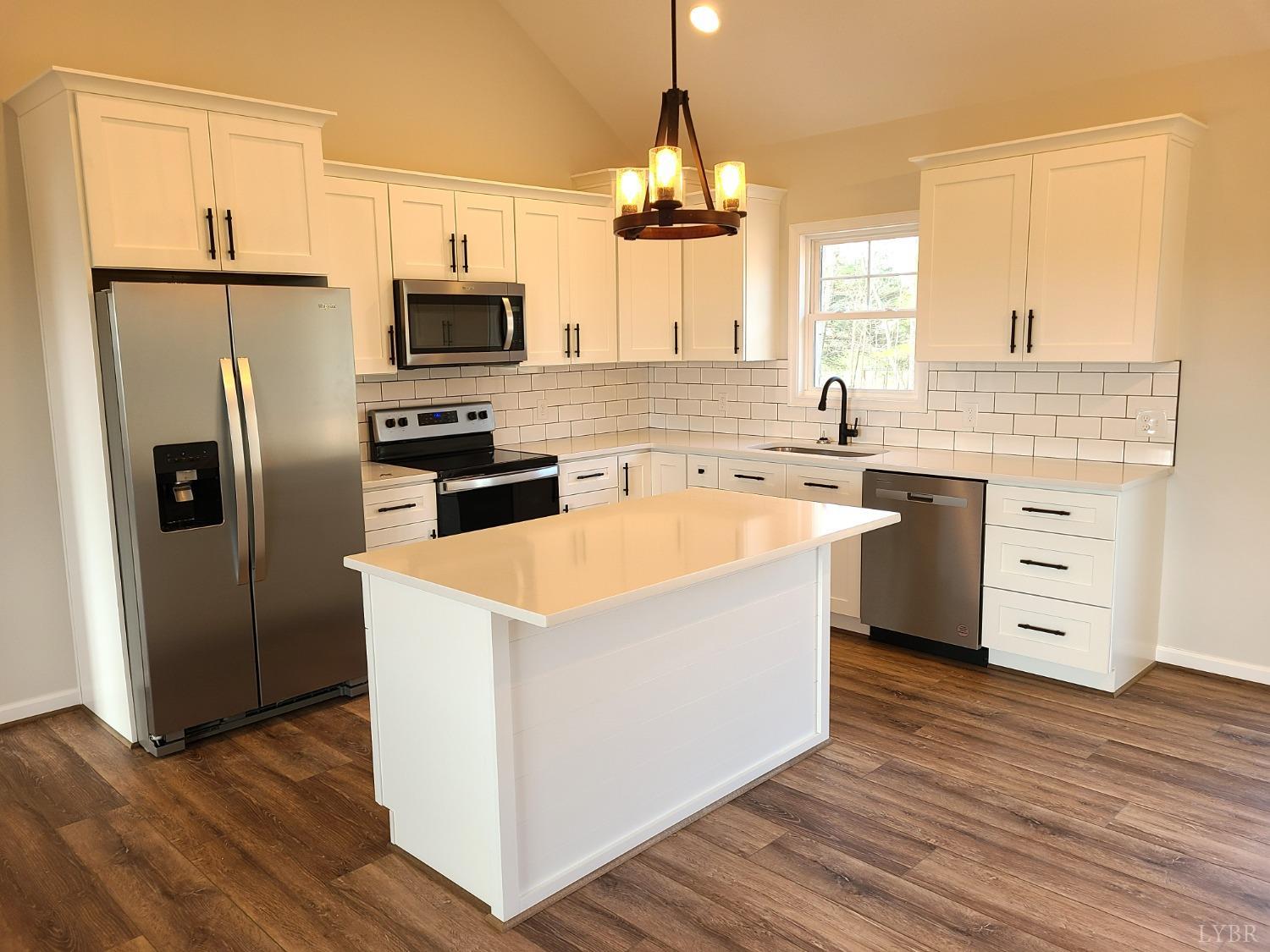 3353 Stonewall Road Concord, VA 24538 - Photo 6 of 21 a kitchen with stainless steel appliances granite countertop a refrigerator a stove a sink and a microwave