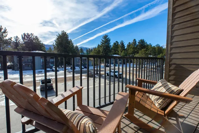 a view of a balcony with furniture