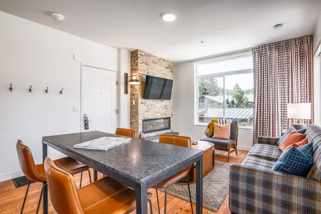 a view of a livingroom with furniture and a window