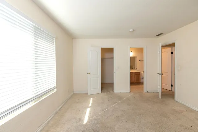 a view of empty room with windows