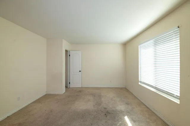 an empty room with windows