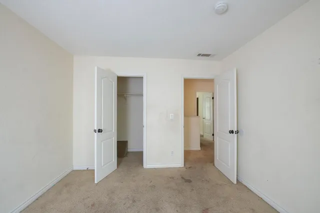 an empty room with closet