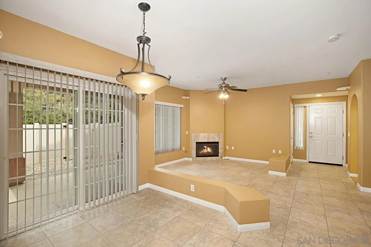 2715 Lake Pointe Drive, Unit 121 Spring Valley, CA 91977 - Photo 1 of 27 a view of a livingroom with a chandelier fan and a floor to ceiling window