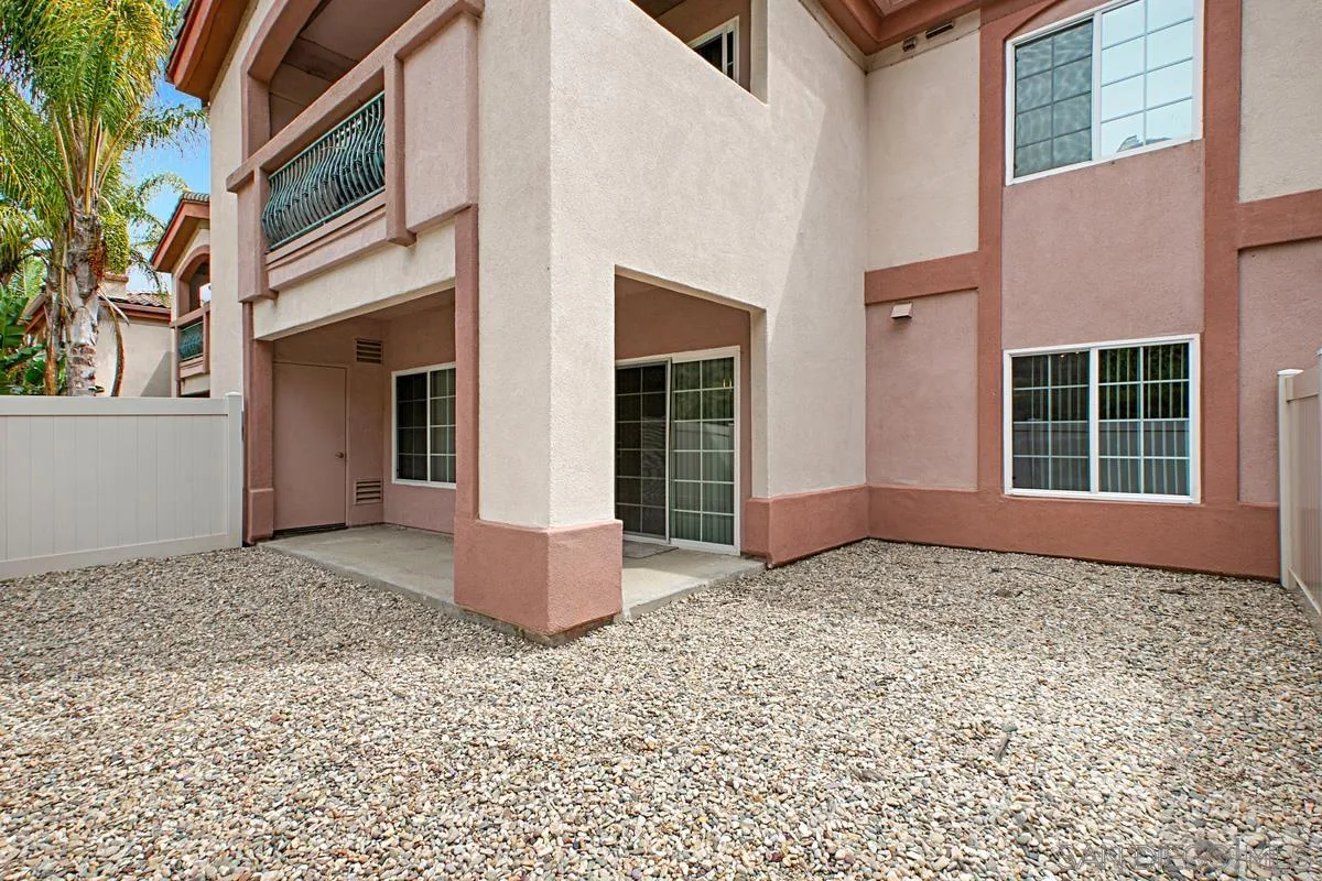 2715 Lake Pointe Drive, Unit 121 Spring Valley, CA 91977 - Photo 24 of 27 a view of a house with a wooden bench