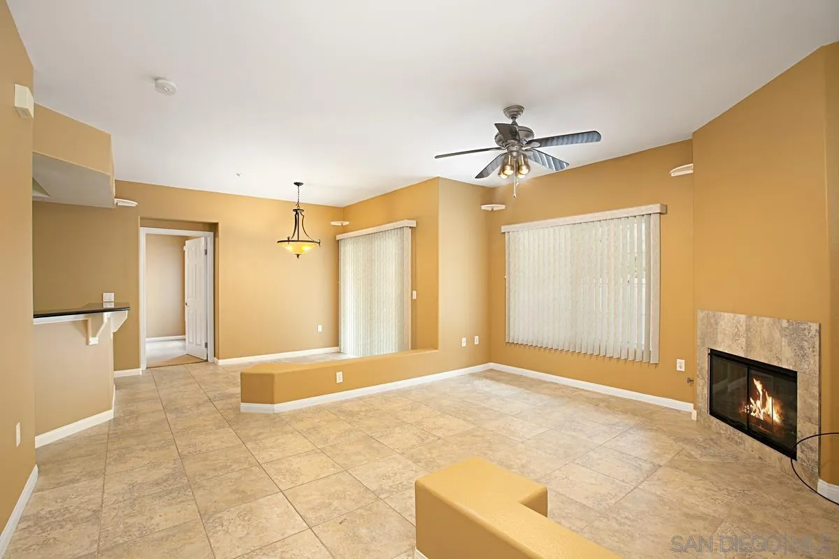 2715 Lake Pointe Drive, Unit 121 Spring Valley, CA 91977 - Photo 3 of 27 a view of a livingroom with a fireplace and a chandelier fan