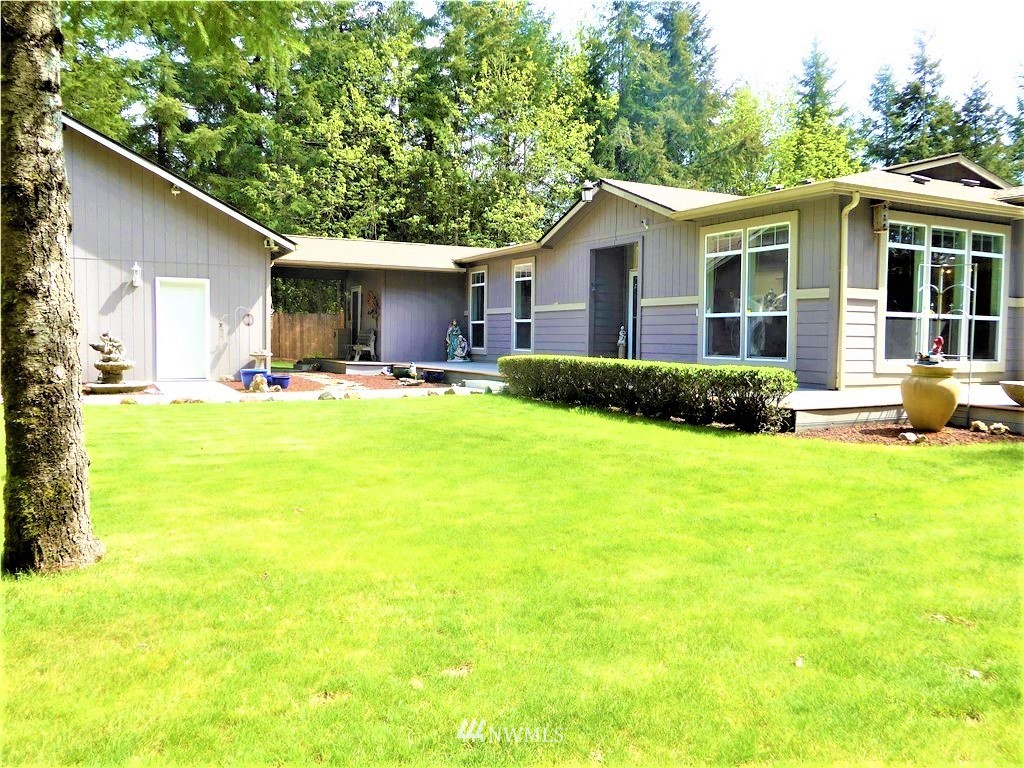 137 Smith Road Centralia, WA 98531 - Photo 2 of 39 a view of a house with a patio and a yard
