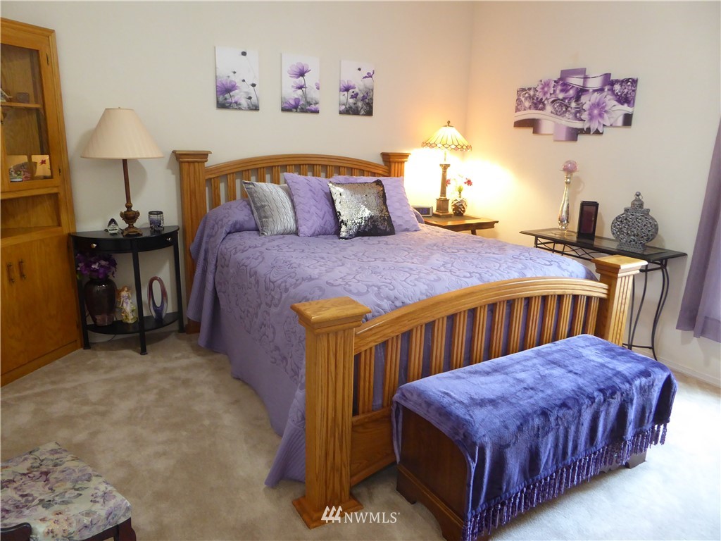 137 Smith Road Centralia, WA 98531 - Photo 30 of 39 a bedroom with a bed and a painting on the wall