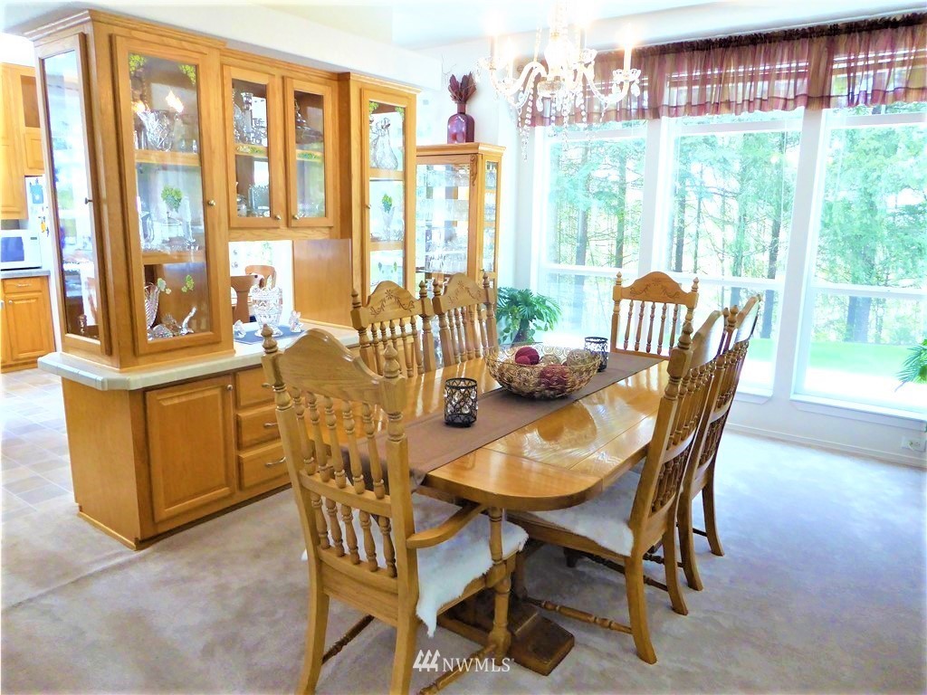 137 Smith Road Centralia, WA 98531 - Photo 10 of 39 a view of a dining room with furniture large windows and wooden floor