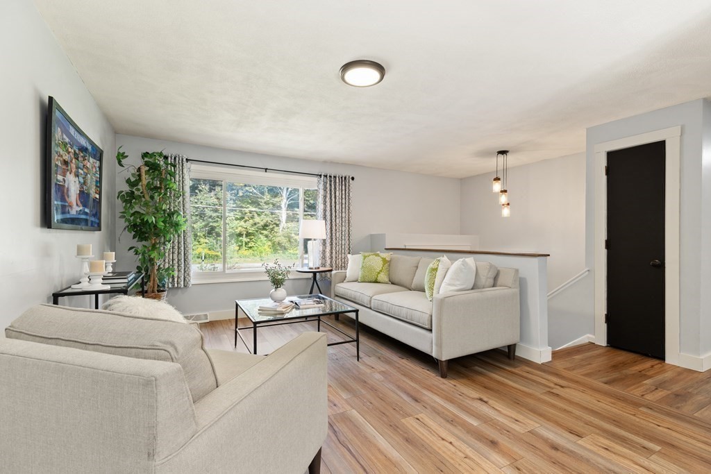 3 Proctor Road Townsend, MA 01469 - Photo 2 of 19 a living room with furniture and a large window