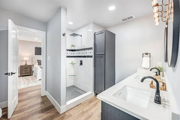 a bathroom with a sink and a mirror