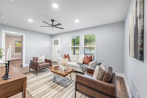 a living room with furniture and a large window