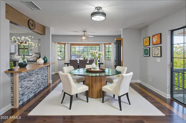 a view of a dining room with furniture window and wooden floor