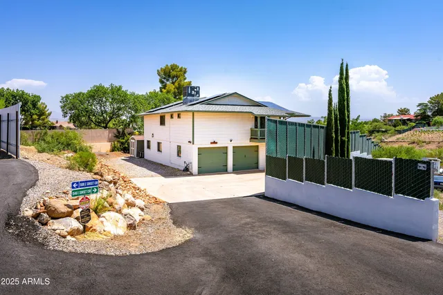 a view of a house with a yard from a balcony