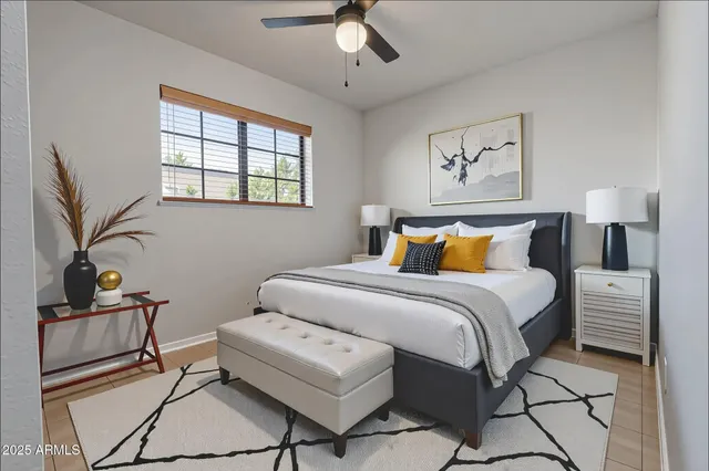 a bedroom with a large bed and a window