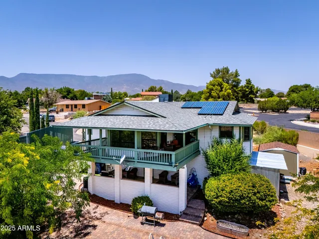 a aerial view of a house with a yard