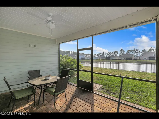 a view of a chairs and table in the patio
