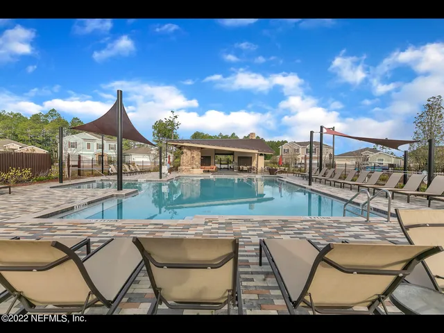 a view of swimming pool with a yard