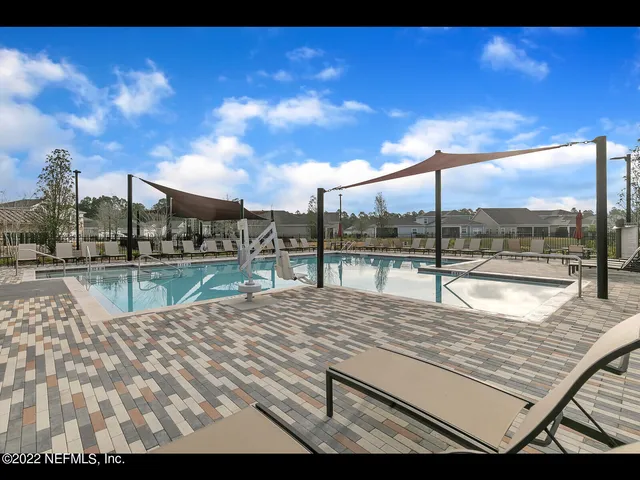 a view of a swimming pool with a patio