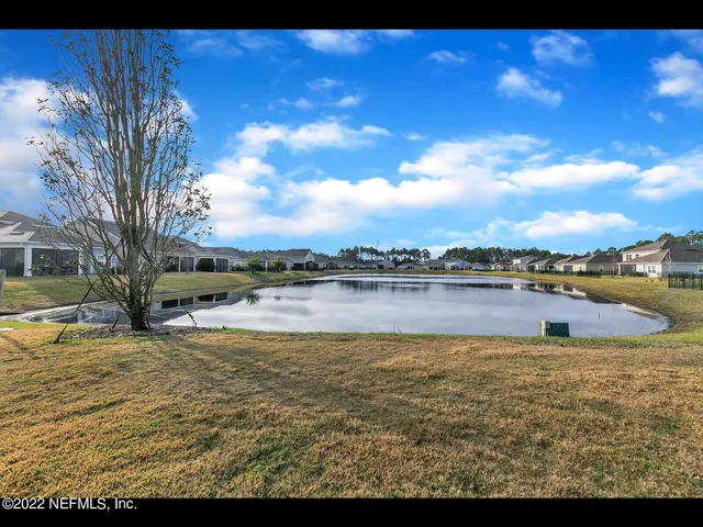 a view of a lake with a yard