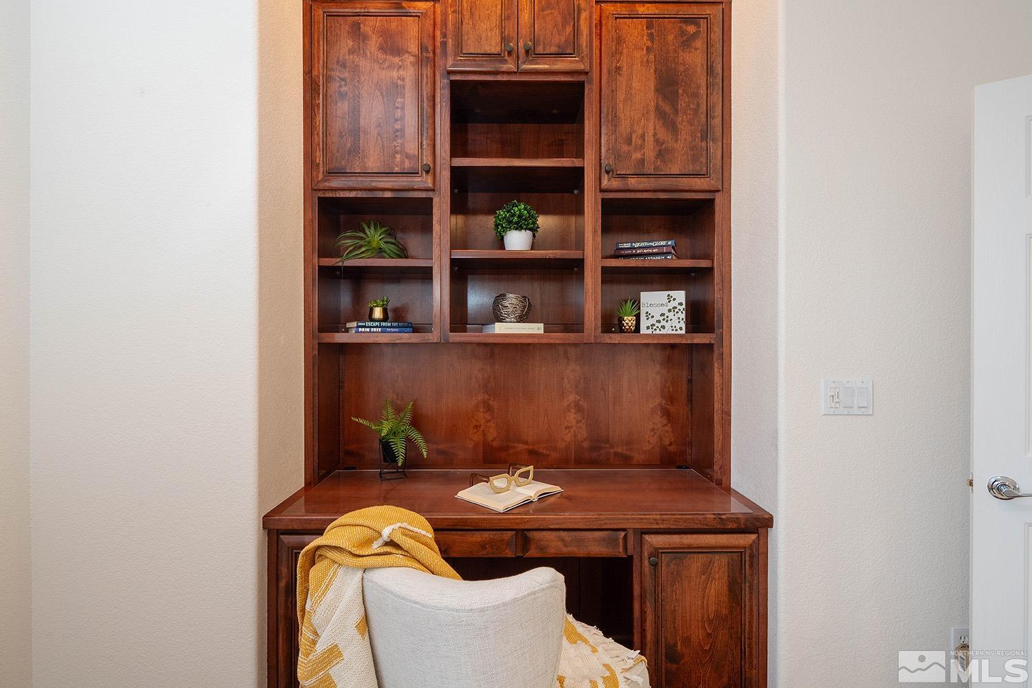 7340 Tempe Court Reno, NV 89511 - Photo 23 of 38 a room with a table and a book shelf