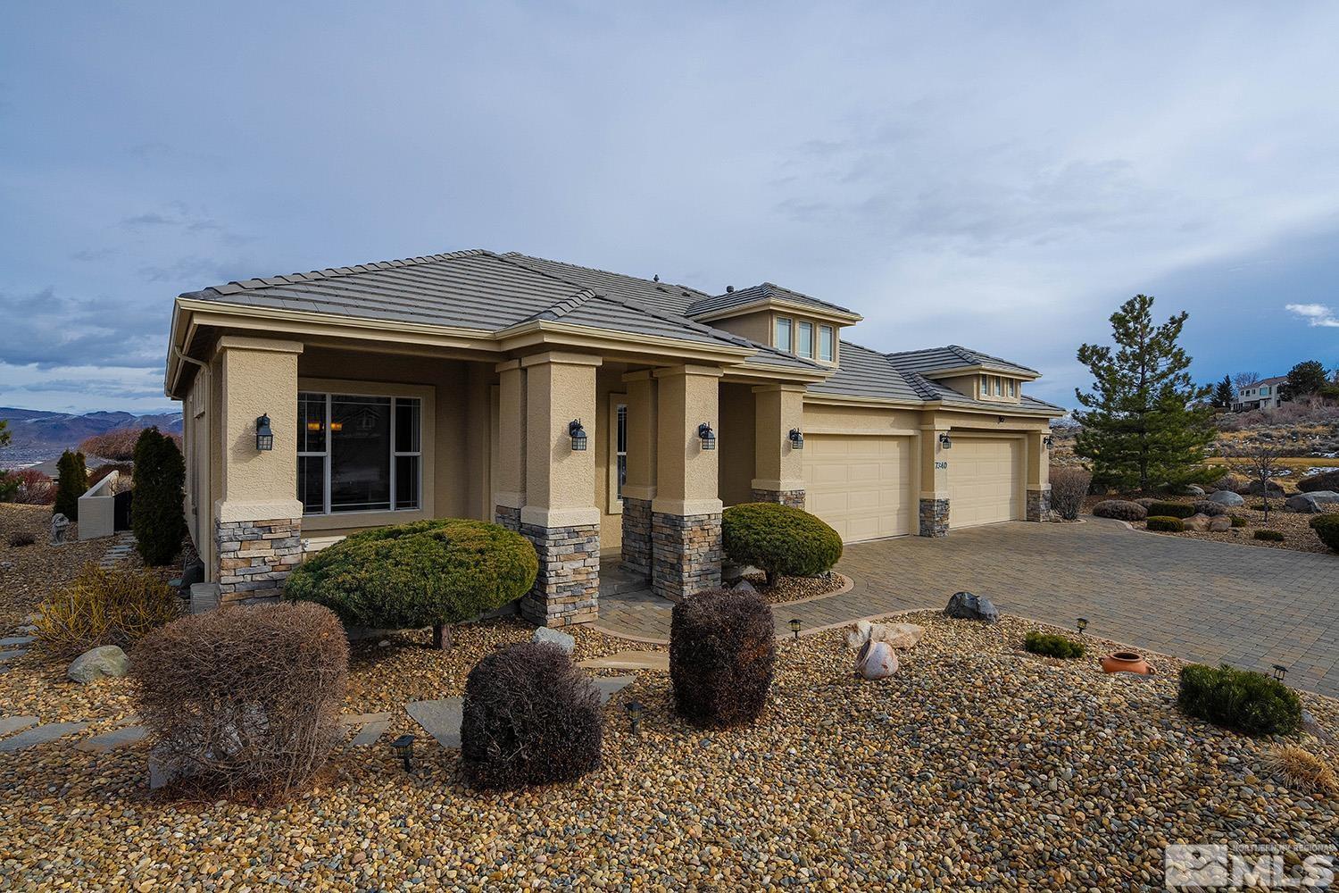 7340 Tempe Court Reno, NV 89511 - Photo 34 of 38 a front view of a house with garden
