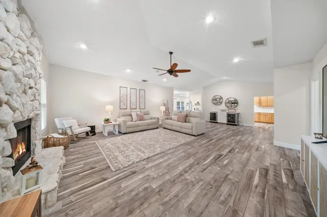 a spacious bedroom with a large bed and a fireplace