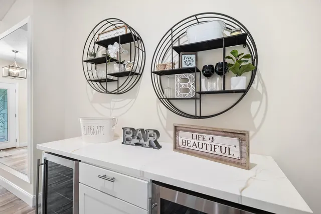 a large kitchen with kitchen island a large counter top space a sink stainless steel appliances and cabinets