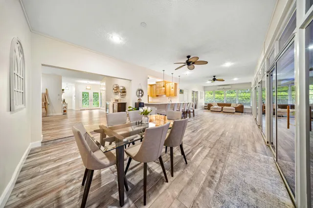 a living room with furniture windows and wooden floor
