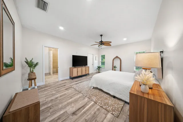 a walk in closet with a rug