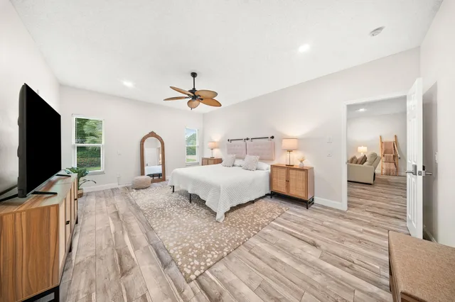 a spacious bathroom with a granite countertop sink mirror and double