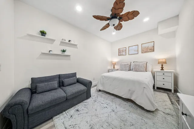 a bedroom with two beds and a window