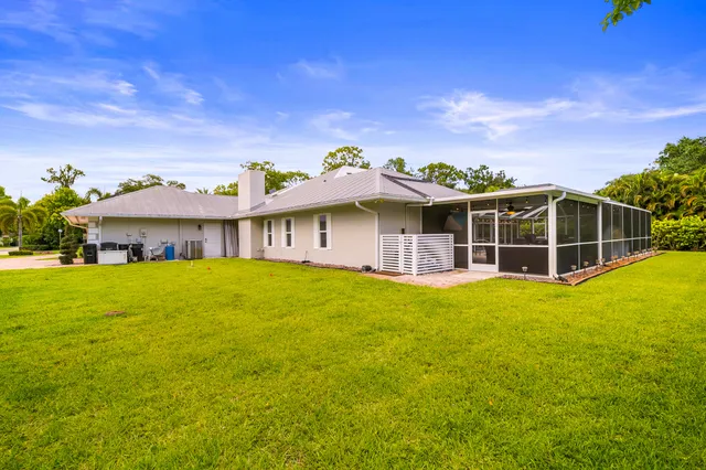 a front view of a house with yard and porch