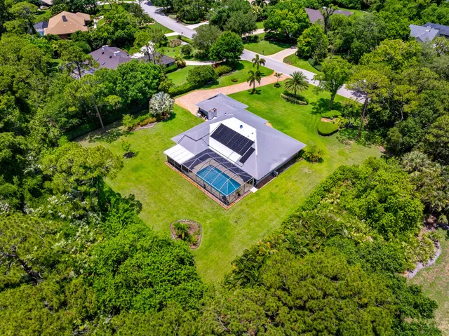 a view of a swimming pool with lounge chairs