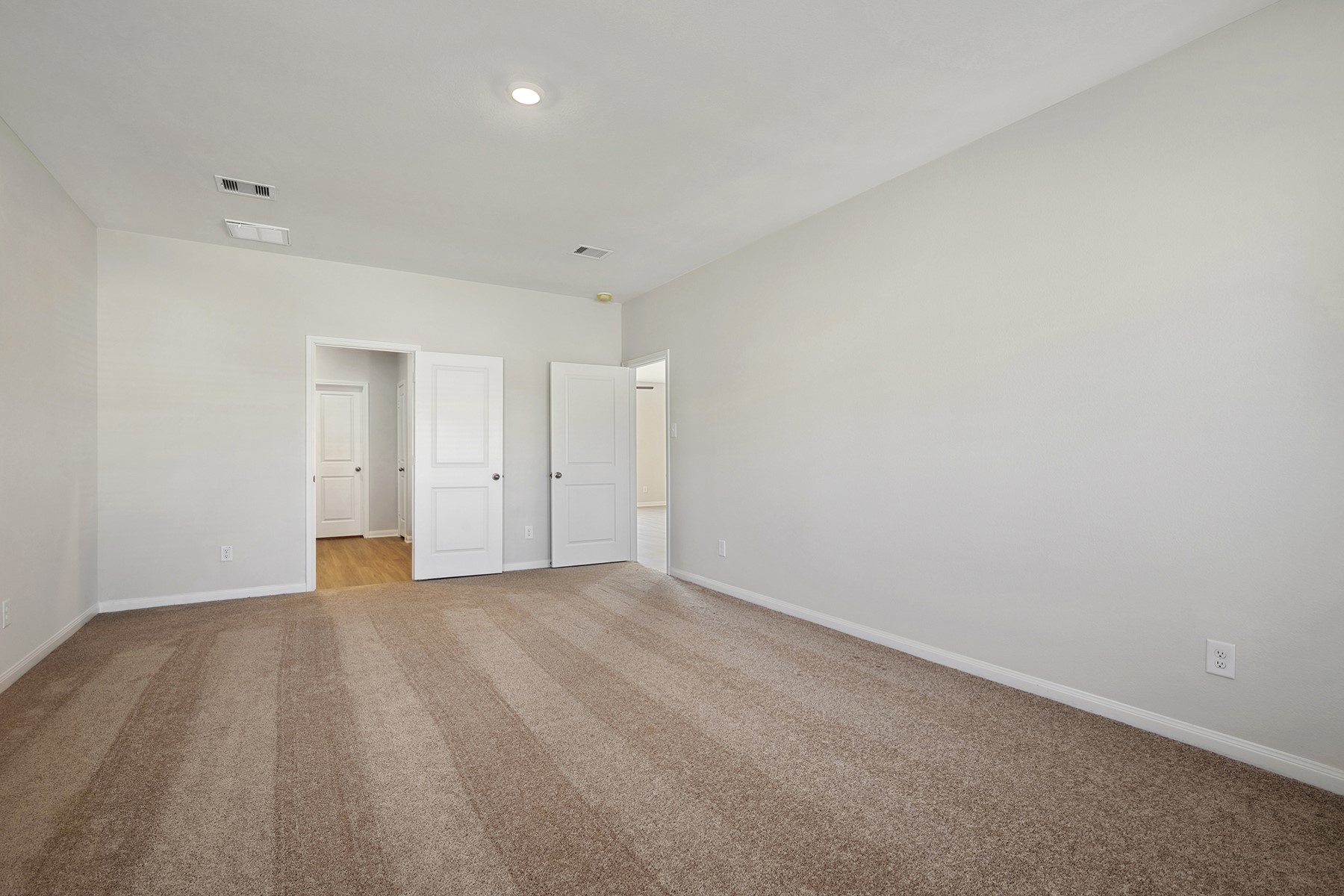 360 Kingston Way Waller, TX 77484 - Photo 13 of 21 a view of an empty room with wooden floor