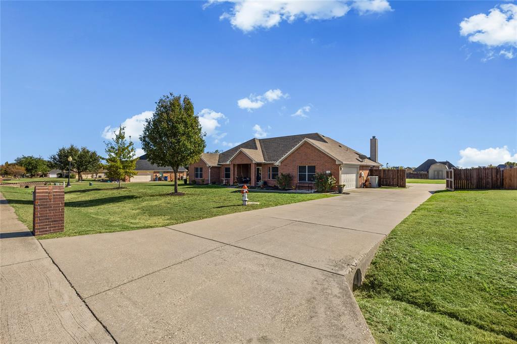 112 Springfield Lane Red Oak, TX 75165 - Photo 2 of 40 a front view of a house with a yard