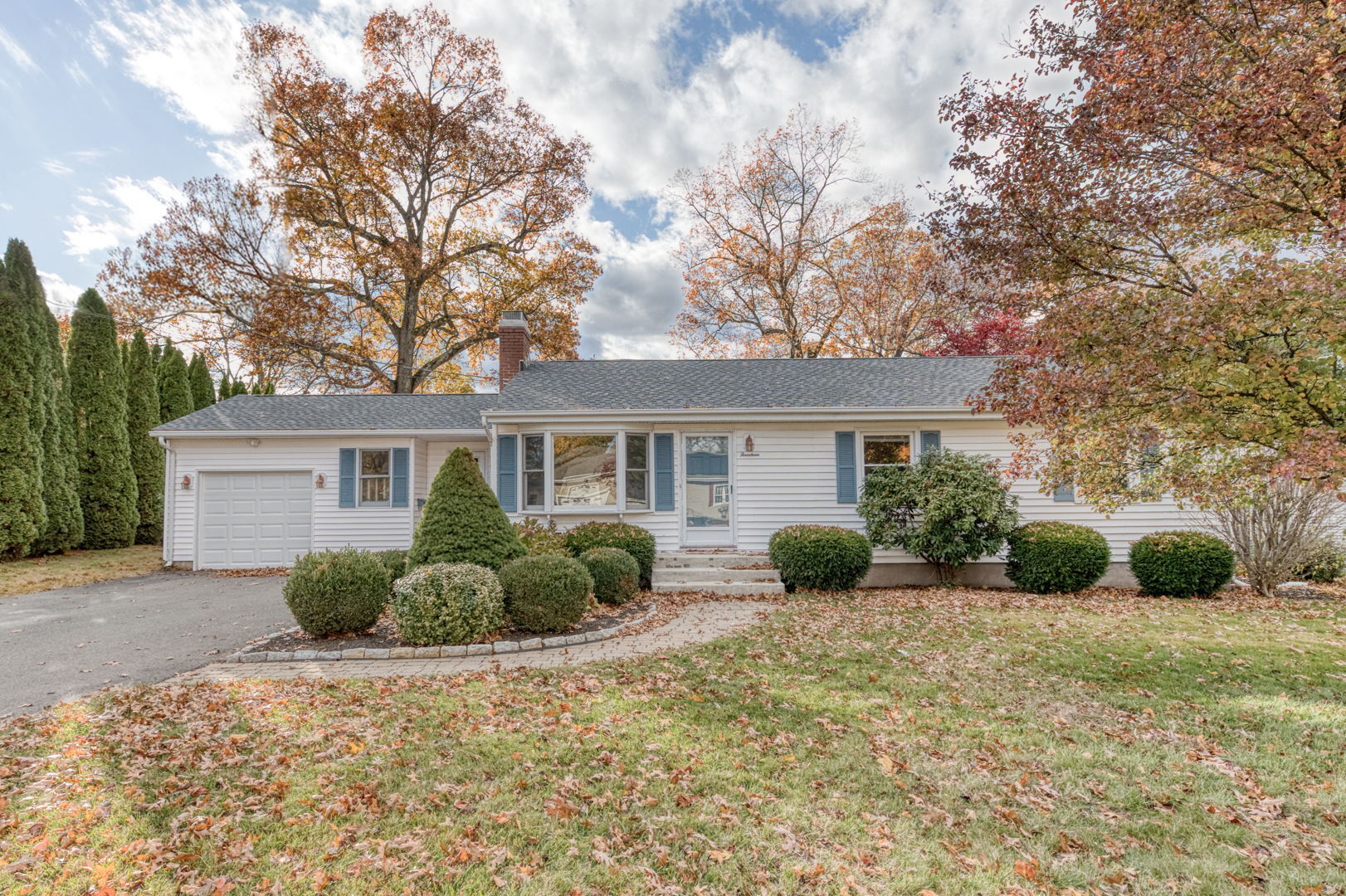 a front view of a house with garden