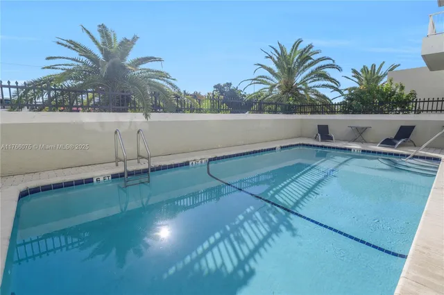 a view of a swimming pool and a chair