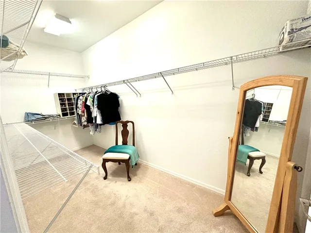 a view of a hallway with seating area