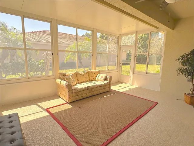 a living room with large windows