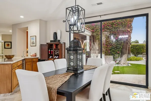 a view of a dining room with furniture window and outside view