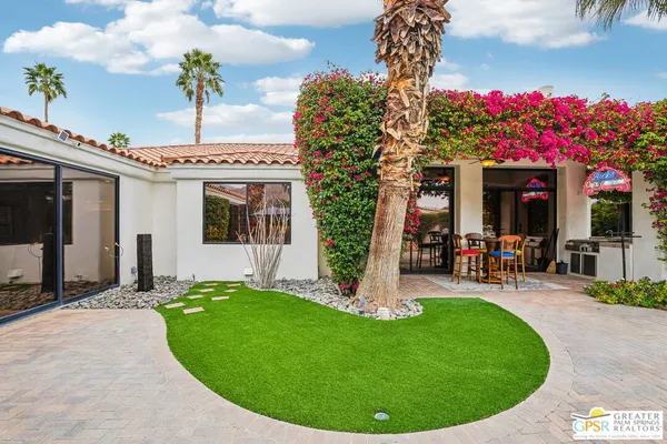 a view of a house with a swimming pool