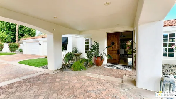 a view of a backyard of the house