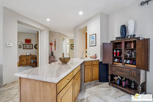 a kitchen with stainless steel appliances granite countertop a sink and cabinets