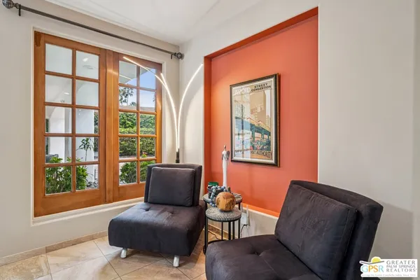 a living room with furniture and a window