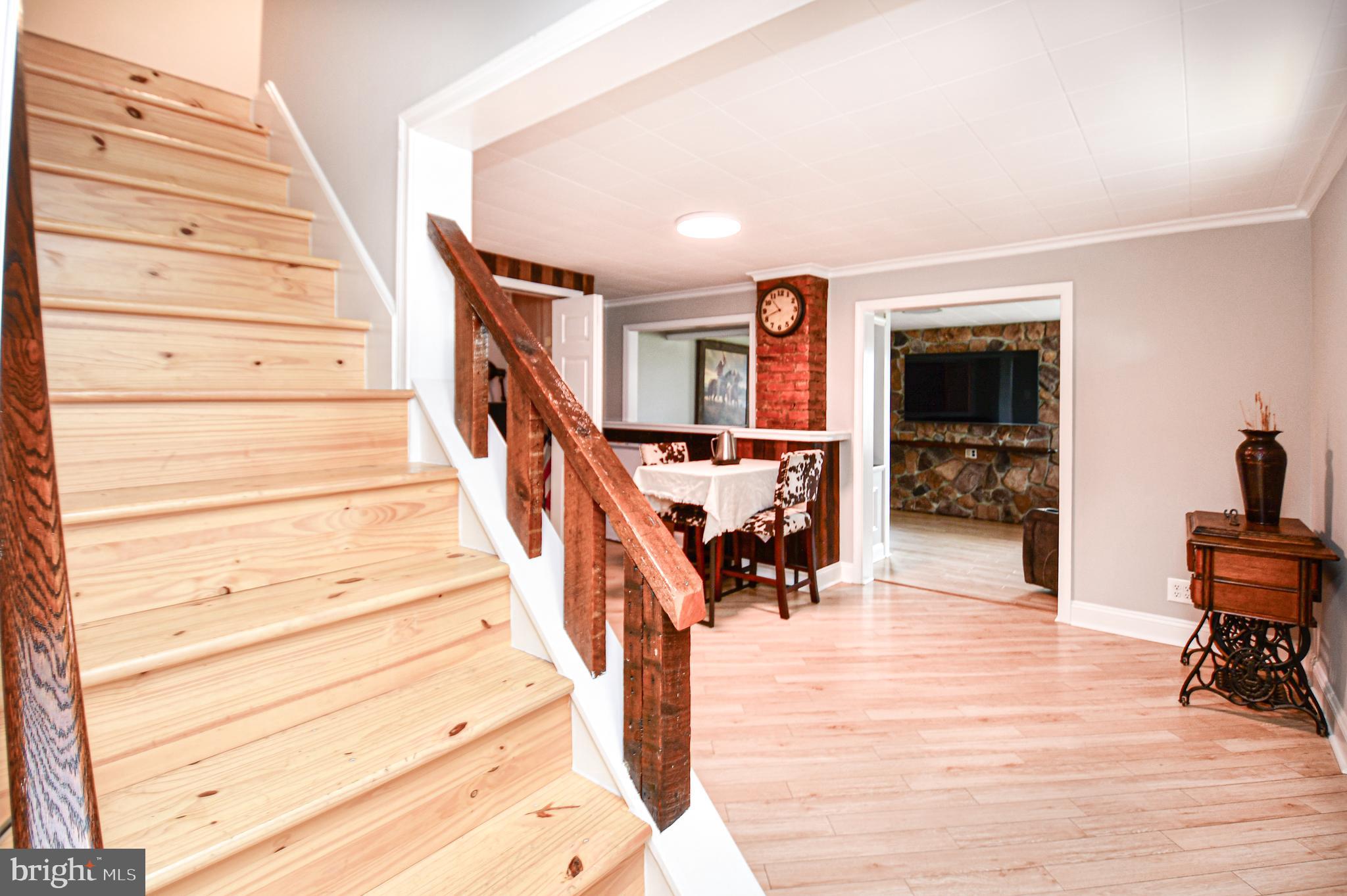 5934 Conover Road Taneytown, MD 21787 - Photo 12 of 38 a view of entryway and hall with wooden floor