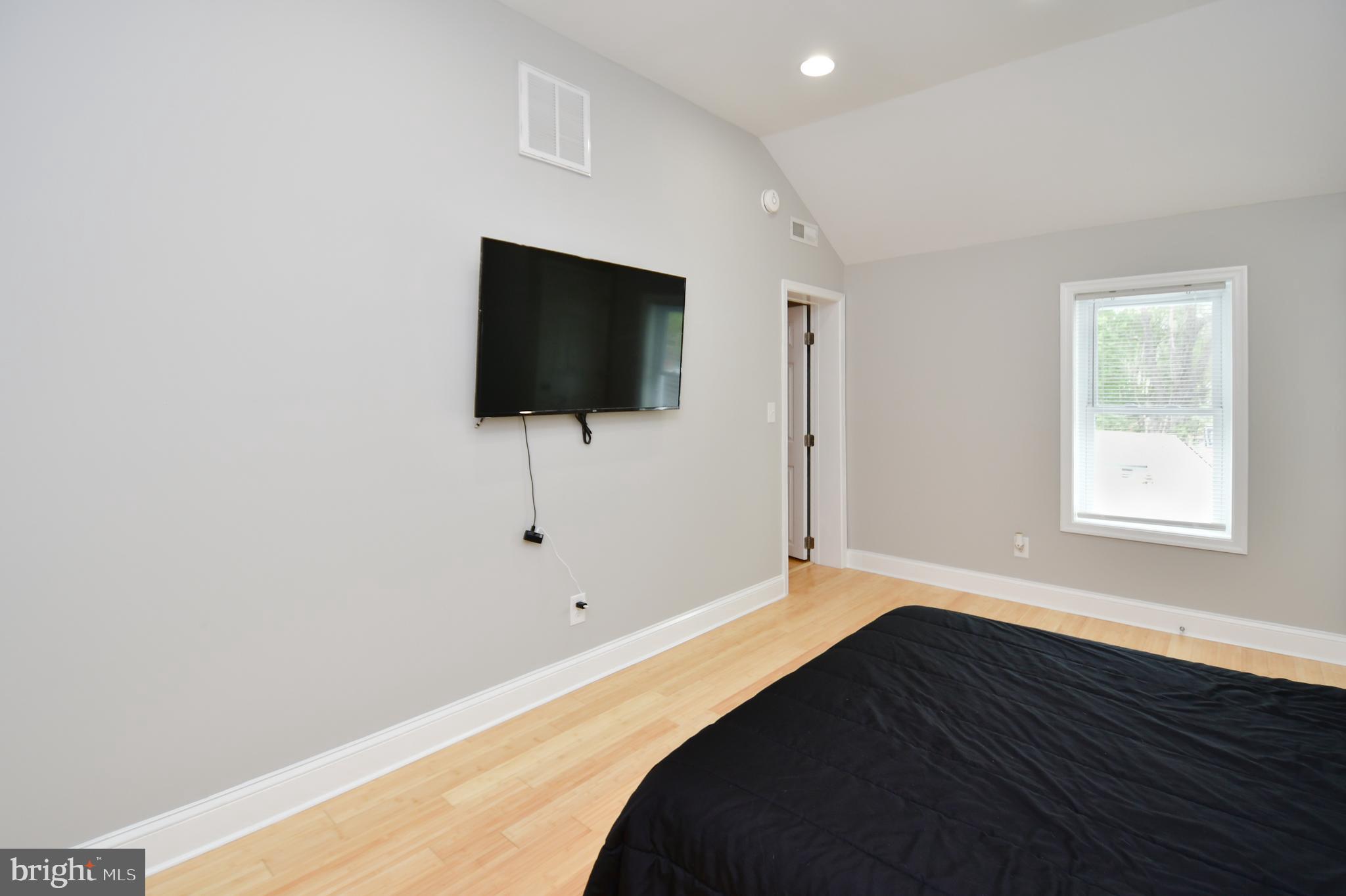 5934 Conover Road Taneytown, MD 21787 - Photo 19 of 38 a bedroom with a bed and a flat screen tv