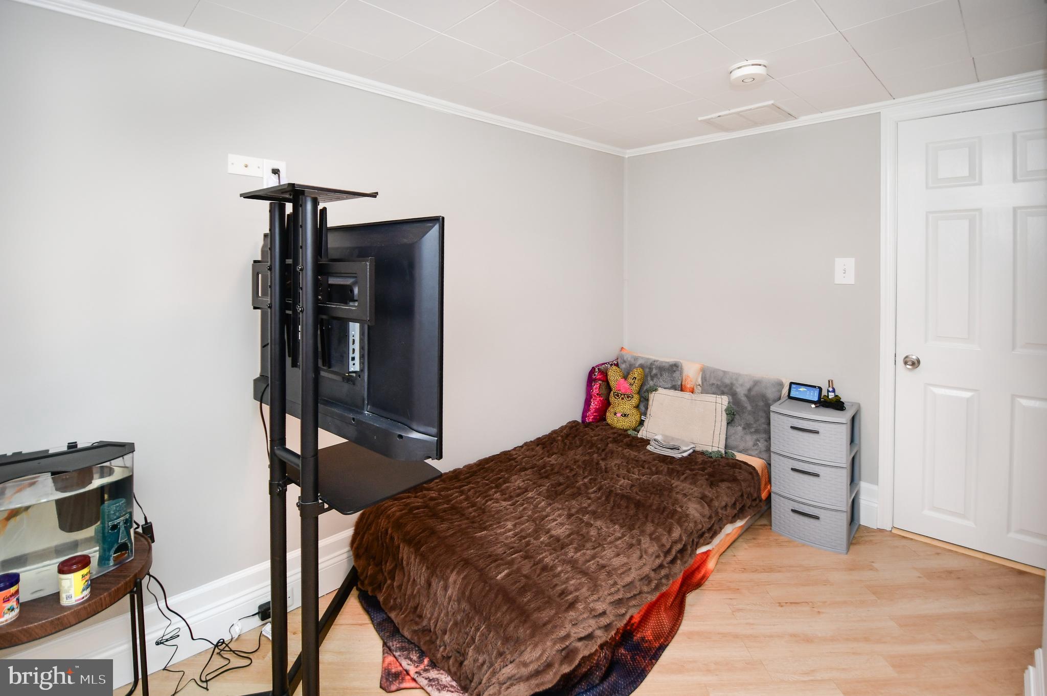 5934 Conover Road Taneytown, MD 21787 - Photo 21 of 38 a bedroom with a bed and cabinets