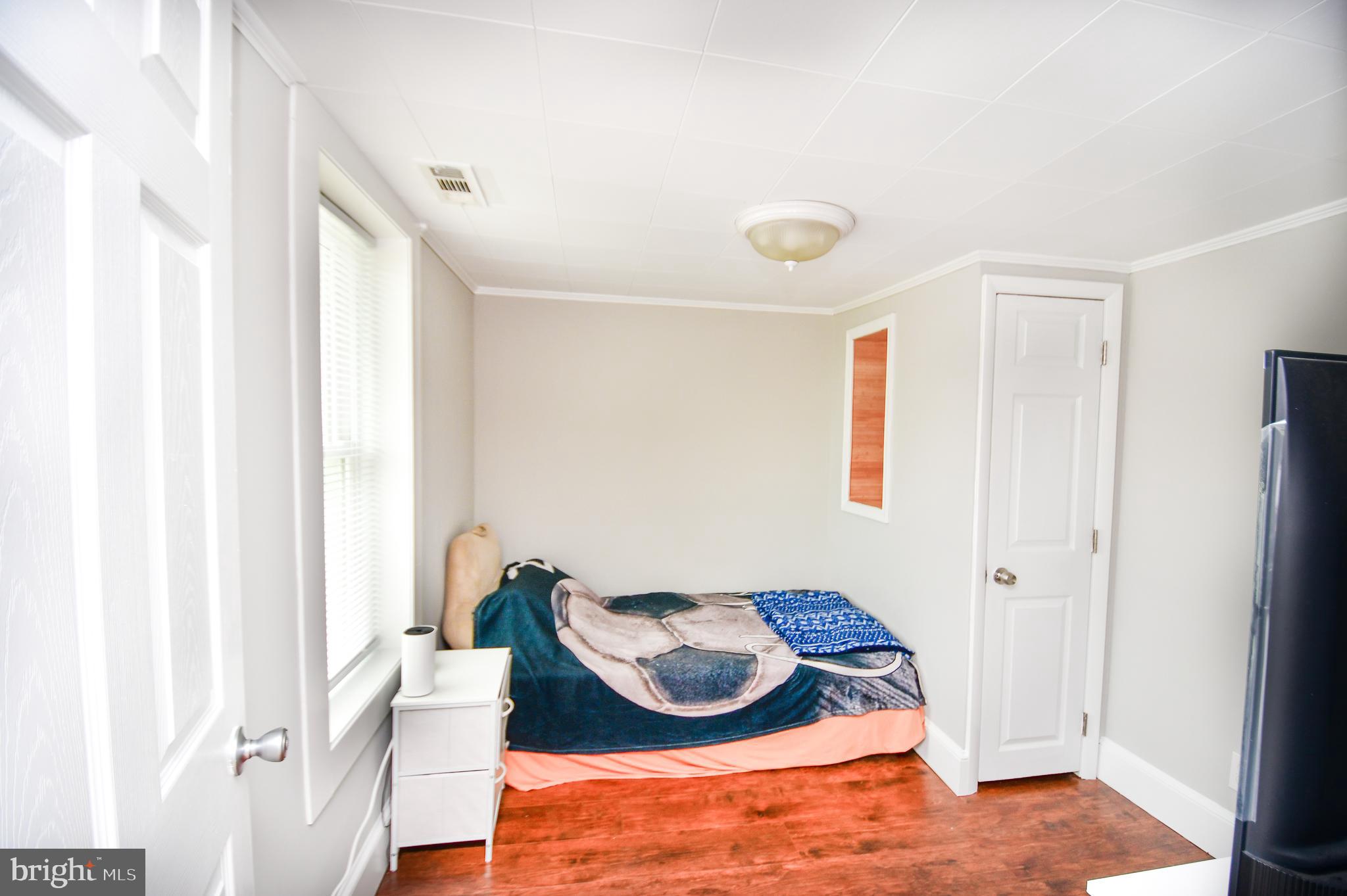 5934 Conover Road Taneytown, MD 21787 - Photo 22 of 38 a room with furniture and a window